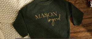Dark green knit sweater embroidered with Mason Boyd