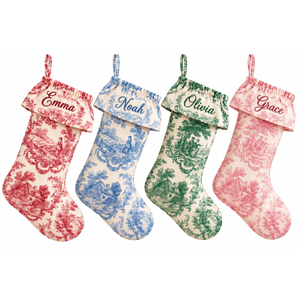 Set of four personalized toile Christmas stockings with ruffled toile cuff in red, blue, dark green and pink