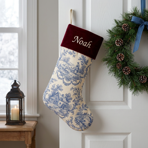 Blue toile personalized Christmas stocking with burgundy velvet cuff